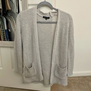 Cute beige cardigan with stitch detail on side